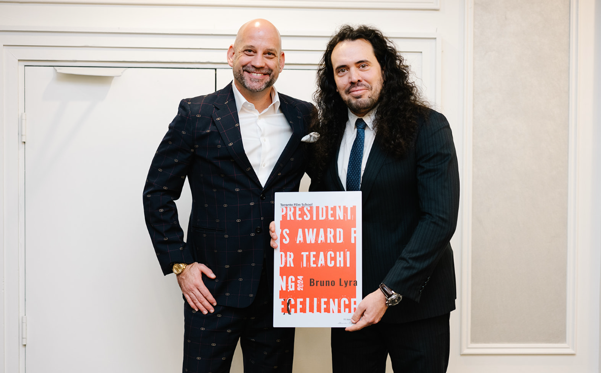TFS President Andrew Barnsley beside TFS Instructor Bruno Lyra holding his inaugural President's Award for Teaching Excellence.
